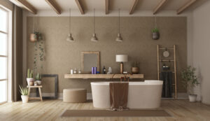 Ein großes Badezimmer mit einer schönen Badewanne und einer beigen Wand und einem Holzboden